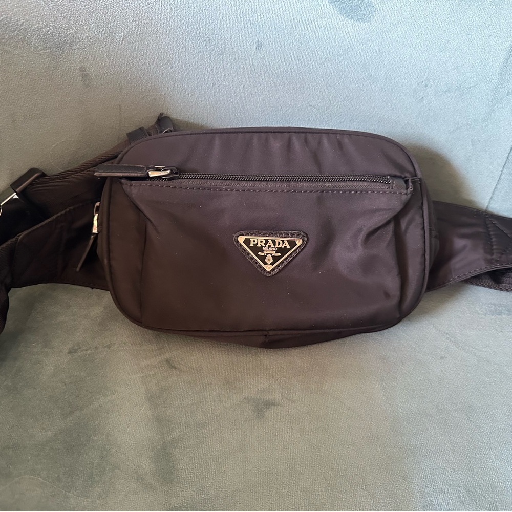 Prada belt bag.  Beautiful 1:1 quality:  this bag is a replica.
